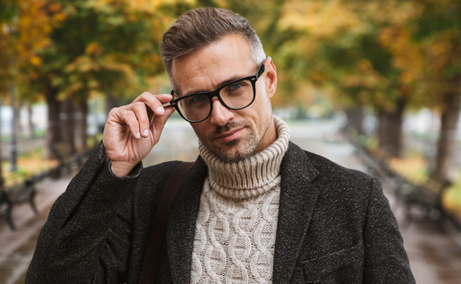 Middle-aged man wearing turtleneck sweater and glasses