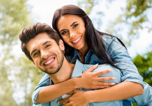 woman on a mans shoulders