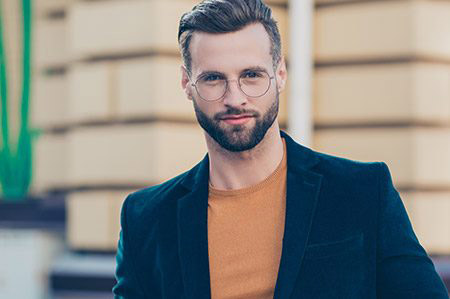 bearded man wearing designer eyeglasses