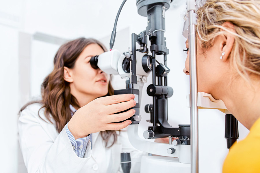 doctor performing an eye exam on a patient